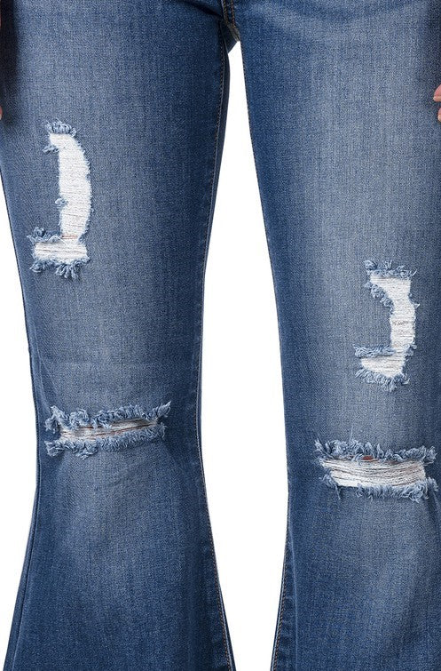Pantalón acampanado de mezclilla con tiro alto y desgaste