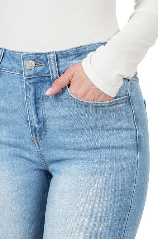 Pantalón boot cut de mezclilla stretch y tiro medio